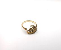 A Victorian yellow metal (tests as 9ct) diamond set crescent and clover ring inset with diamonds and