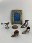 A miscellaneous collection of metal objects. H.15cm (largest)