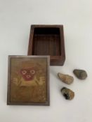 A vintage box with a Central American Pre-Columbian tapestry inset to the top within a white metal