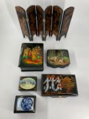 A collection of hand decorated Russian lacquered miniature boxes along with a similar oriental