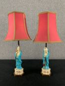 A pair of table lamps with Sancai figural bases. H.57cm (each with shade)