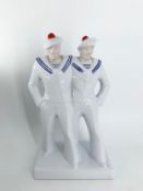 After Edouard Cazaux, a French Art Deco porcelain figure group, sailors. H.36cm