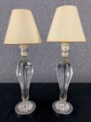A pair of contemporary glass table lamps of baluster form. H.41cm (each with shade)