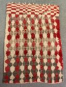 A vintage shag pile carpet of geometric design. L.220 W.141cm