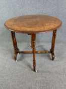 A 19th century burr walnut Sutherland table with drop leaf action. H.72 W.100 D.77cm