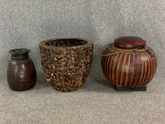 Three various carved and woven pots and planters. H.47cm (largest)