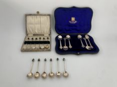 Two sets of cased hallmarked silver teaspoons and a set of silver plated coffee bean spoons,