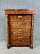A 19th century Empire style chest of four drawers flanked by ormolu mounted pilasters. H.112 W.80