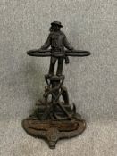 A 19th century cast iron umbrella stand with sailor figure and maritime motifs. H.68cm