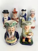 A collection of 19th century toby jugs. H.31cm (largest)