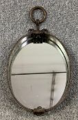 A contemporary antique style wall mirror. H.53 W.28cm