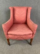 Armchair, C.1900 mahogany on brass casters. H.88 W.73 D.71cm