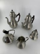 A Brazilian pewter coffee set, hallmarked and marked to the base. H.27cm (largest)