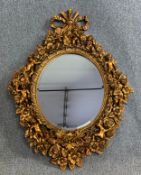 A 19th century style moulded gilt frame wall mirror with bevelled plate. H.125 W.92cm