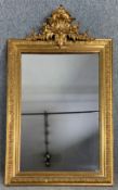 A 19th century French pier mirror with original plate in carved giltwood frame with foliate