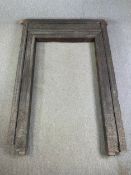 A large profusely carved Indian hardwood door frame in six sections, possibly 19th century. H.260