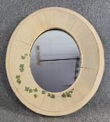 A distressed painted frame oval wall mirror. H.85 W.72cm