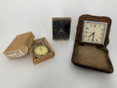 A vintage Smith's travel alarm clock, a similar stopwatch and a Swiss made dressing table clock. H.