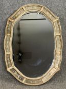 A painted 19th century Continental style wall mirror with shaped bevelled plate. H.88 W.63cm