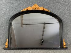 A moulded ebonised and gilt framed Victorian style overmantel mirror. H.92 W.123cm