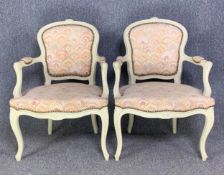 A pair of Louis XV style open armchairs in painted frames. H.85 W.60 D.55cm