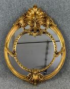 A 19th century style moulded gilt framed wall mirror. H.79 W.60cm