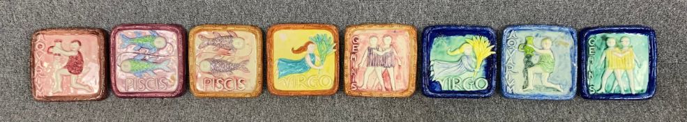 A collection of art pottery wall hanging signs of the zodiac. H.19 W.19cm (each)