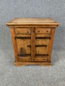 A small Indian hardwood metal bound side cabinet. H.60 W.54 D.37cm