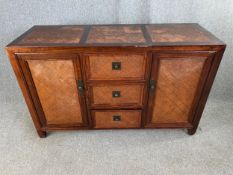 An Eastern hardwood and rattan side cabinet. H.87 W.140 D.50cm