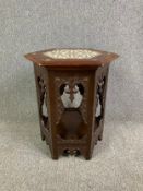 A C.1900 carved hardwood Damascus style occasional table with mother of pearl inlaid top. H.63cm