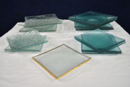A collection of art glass plates. Largest L.26.5 W.26.5cm