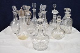 A miscellaneous collection of 19th century and later decanters. Largest H.31cm
