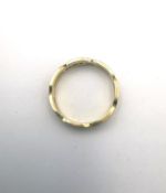 An 18ct yellow gold carved and engraved twisted design keeper ring by Padgett & Braham Ltd.
