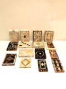 A collection of fourteen Victorian mother of pearl, abalone and tortoise shell card cases and a