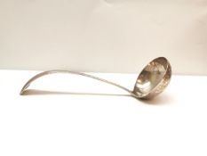 An early 20th century Dutch silver soup ladle by JAA Gerritsen with beaded design to the edge.