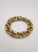 A statement 14 carat yellow gold double link bracelet with hidden push clasp and safety catch.