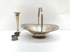 A collection of silver, including a pierced and engraved urn and foliate swag design swing handled