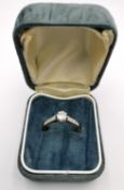 An Edwardian 18ct gold and platinum diamond solitaire ring, set to centre with a round old cut