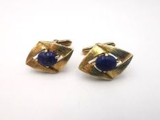 A pair of vintage 14 carat yellow gold and Lapis lazuli hinged diamond shaped textured cufflinks.