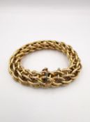 A statement vintage 18ct yellow gold Persian weave linked bracelet with hidden push clasp and safety