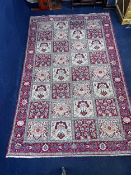 A Bakhtiar carpet with foliate panels within flowerhead multiple borders. L.310 W.193cm