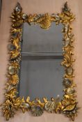 A large pier mirror, contemporary carved gilt and silvered shell designs. H.160 W.90 D.5cm