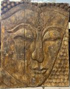 A large Eastern panel with a carved Buddha's head. H.122 W.99 D.8cm