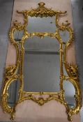 A full height contemporary gilt framed mirror in the Chinese Chippendale style. H.222 W.123 D.10cm