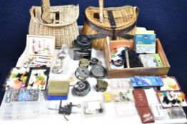 Two vintage fly fishing rods, one split cane along with a collection of fly fishing equipment,