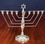 A silver menorah by Alexander Smith, bears English hallmark, Birmingham 1963. 297 grams (not filled)