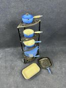 A collection of Le Creuset saucepans etc on a Le Creuset corner stand. H.90 W.30cm