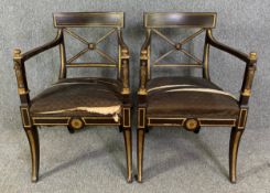 A pair of Regency painted and parcel gilt armchairs with figural classical detail to the arms. H.