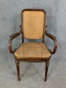 A 19th century Thonet bentwood armchair with label to the underside. H.102 W.62 D.50cm