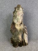 A carved and distressed painted figure of Guanyin. H.90cm